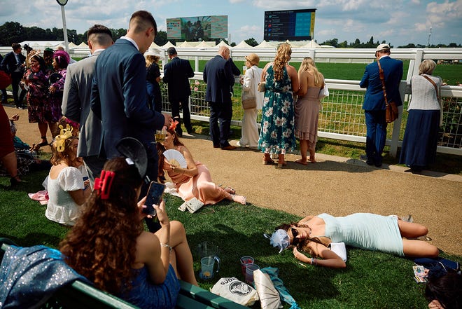 Racegoers attend the first day of the Royal Ascot horse racing meeting, in Ascot, west of London, on June 18, 2024.