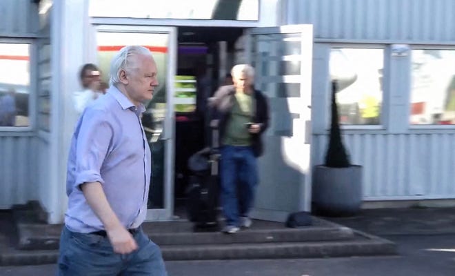 This screen shot courtesy of WikiLeaks X page shows Wikileaks founder Julian Assange walking to board a plane from London Stansted Airport on June 24, 2024. Julian Assange "is free" and has been released from a high-security London prison where he was held for five years, his Wikileaks organization said June 24, after reaching a US plea deal. The 52-year-old Australian was taken Monday, June 24, from Belmarsh prison to London's Stansted airport, a Wikileaks statement said, from where he boarded a flight to an unnamed destination. (Photo by WikiLeaks / AFP) / RESTRICTED TO EDITORIAL USE - MANDATORY CREDIT "AFP PHOTO / HANDOUT / WikiLeaks " - NO MARKETING - NO ADVERTISING CAMPAIGNS - DISTRIBUTED AS A SERVICE TO CLIENTS (Photo by -/WikiLeaks/AFP via Getty Images) ORIG FILE ID: 2158556140