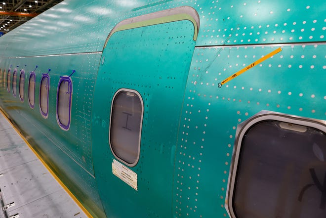 A mid-cabin door plug is seen on a 737 MAX aircraft at the Boeing 737 factory Tuesday, June 25, 2024 in Renton, WA.