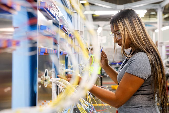 Moushmi Sharma trains on electrical wiring at the Foundational Training Center Tuesday, June 25, 2024 in Renton, WA.