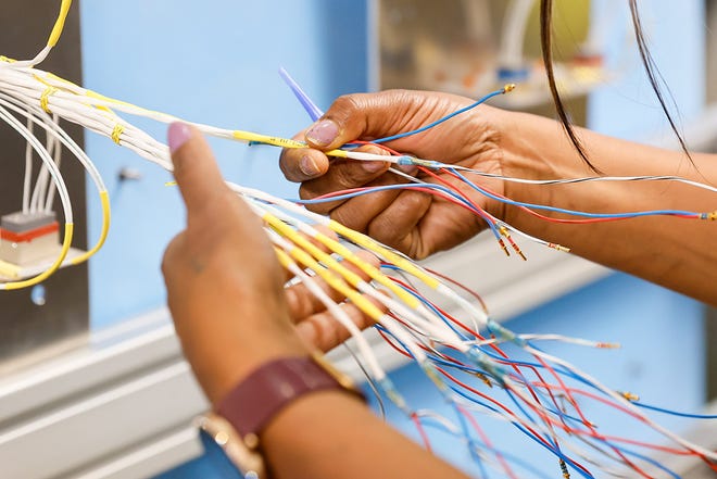 Moushmi Sharma trains on electrical wiring at the Foundational Training Center Tuesday, June 25, 2024 in Renton, WA.