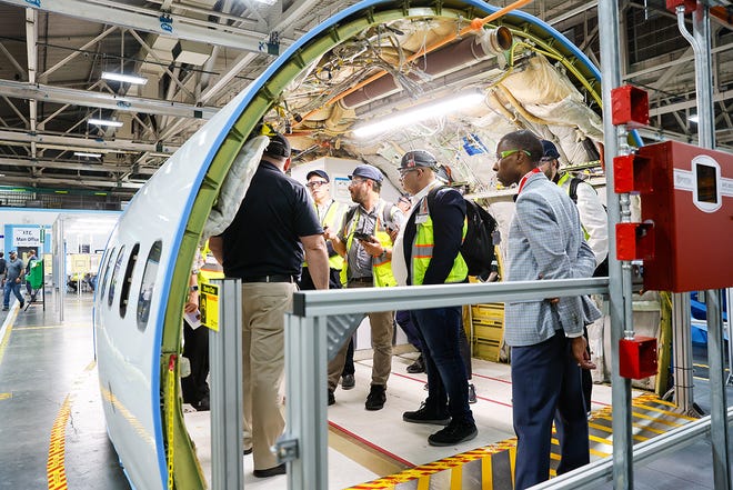 Media stand inside the top half of a 737 fuselage at the Foundational Training Center Tuesday, June 25, 2024 in Renton, WA.