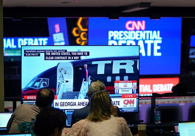 Jun 27, 2024; Atlanta, GA, USA; Live video of former President Donald Trump arriving in Atlanta is broadcast on television monitors at Georgia Tech’s McCamish Pavilion prior to the CNN Presidential Debate between President Joe Biden and former President Donald Trump held at CNN's studios in Atlanta. CNN Anchors Jake Tapper and Dana Bash are moderators of the debate. Mandatory Credit: Jack Gruber-USA TODAY ORG XMIT: USAT-885265 (Via OlyDrop)