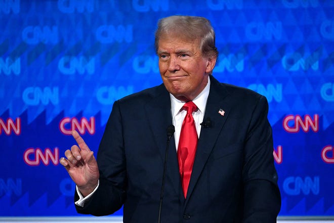 Former US President and Republican presidential candidate Donald Trump speaks as he participates in the first presidential debate of the 2024 elections with US President Joe Biden at CNN's studios in Atlanta, Georgia, on June 27, 2024.