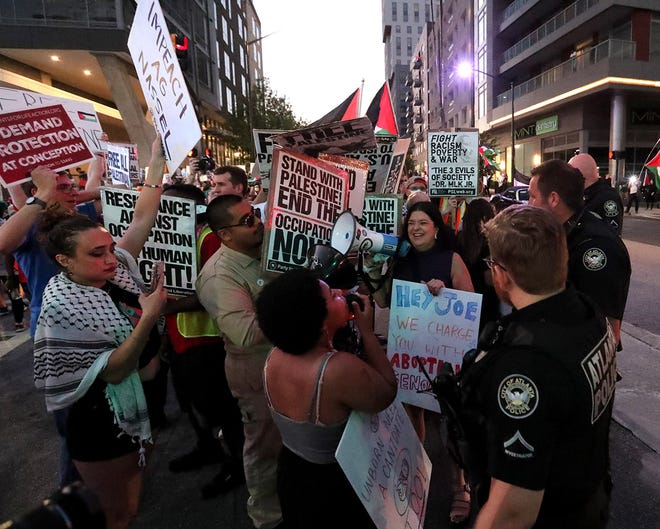 Atlanta Police officers step in as pro-Palestine supporters surround anti-abortion supporters who were attempting to rally on the same corner during the CNN Presidential Debate between President Joe Biden and former President Donald Trump held at CNN's studios in Atlanta.