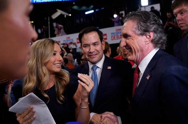 North Dakota Gov. Doug Burgum, right, runs into Senator Marco Rubio (R-FL) while making media rounds in the Spin Room at Georgia Tech's McCamish Pavilion after the CNN Presidential Debate between President Joe Biden and former President Donald Trump held at CNN's studios in Atlanta. CNN Anchors Jake Tapper and Dana Bash are moderators of the debate.