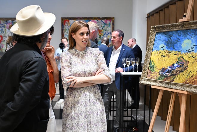 Mr. Brainwash, Natalie Pinkham and Princess Beatrice of York attend the presentation of Mr. Brainwash by Clarendon Fine Art and Jack Barclay Bentley on July 1, 2024, in London.