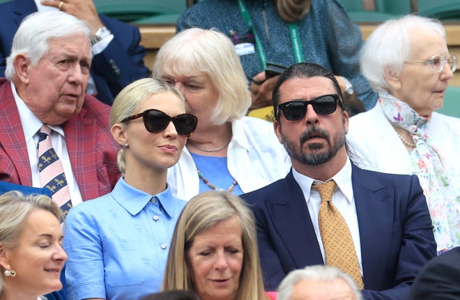 Foo Fighters singer Dave Grohl, right, and his wife Jordyn Grohl are seen in the royal box ahead of the Ladies' Singles first round match between Jessica Bouzas Maneiro and Marketa
Vondrousova during day two of Wimbledon at All England Lawn Tennis and Croquet Club in London on July 2, 2024.