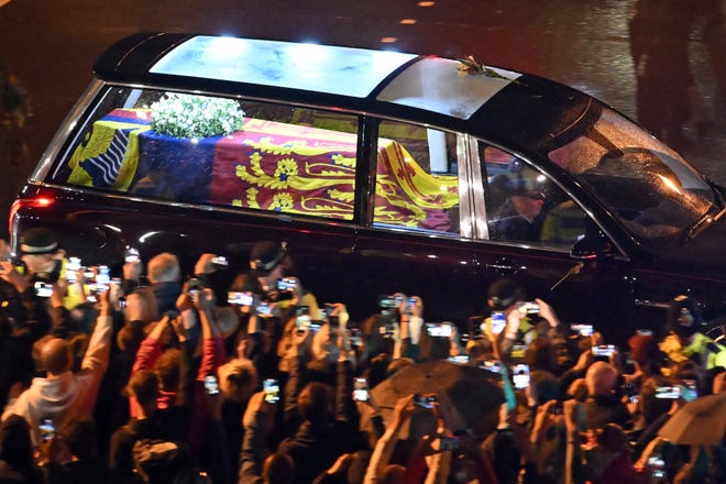 Seen from the top of the Wellington Arch, the coffin of Queen Elizabeth II is taken in a royal hearse to Buckingham Palace to lie at rest overnight in the Bow Room on September 13, 2022 in London, England. The coffin carrying Her Majesty Queen Elizabeth II leaves St Giles Church traveling to Edinburgh Airport where it will be flown to London and transferred to Buckingham Palace by road. Queen Elizabeth II died at Balmoral Castle in Scotland on September 8, 2022, and is succeeded by her eldest son, King Charles III.