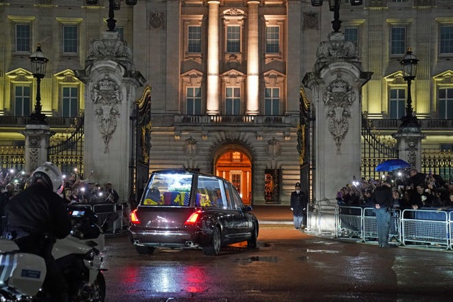 The Royal Hearse carrying the coffin of Queen Elizabeth II arrives at Buckingham Palace on September 13, 2022 in London, England. The coffin carrying Her Majesty Queen Elizabeth II leaves St Giles Church traveling to Edinburgh Airport where it will be flown to London and transferred to Buckingham Palace by road. Queen Elizabeth II died at Balmoral Castle in Scotland on September 8, 2022, and is succeeded by her eldest son, King Charles III.