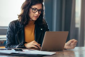 Woman in an office working from a laptop