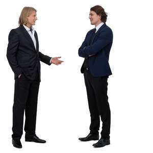 two men in suits standing and talking