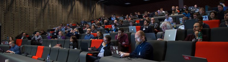 The venue was a theatre. Everyone has a laptop in front of them.