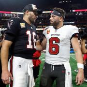 Atlanta Falcons quarterback Kirk Cousins (18) talks to Tampa Bay Buccaneers quarterback Baker Mayfield (6) after the Falcons defeated the Buccaneers during overtime in an NFL football game Thursday, Oct. 3, 2024, in Atlanta. (AP Photo/Butch Dill)