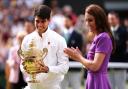 Carlos Alcaraz (left) is presented with the trophy by the Princess of Wales after victory in the Gentlemen's Singles Final against against Novak Djokovic