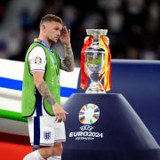 England’s Kieran Trippier walks past the trophy after the Euro 2024 final defeat to Spain (Bradley Collyer/PA)