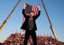 Elon Musk walks to the stage to speak alongside Donald Trump at a campaign event at the Butler Farm Show, (Alex Brandon/AP)