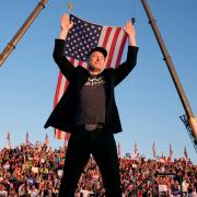 Elon Musk walks to the stage to speak alongside Donald Trump at a campaign event at the Butler Farm Show, (Alex Brandon/AP)