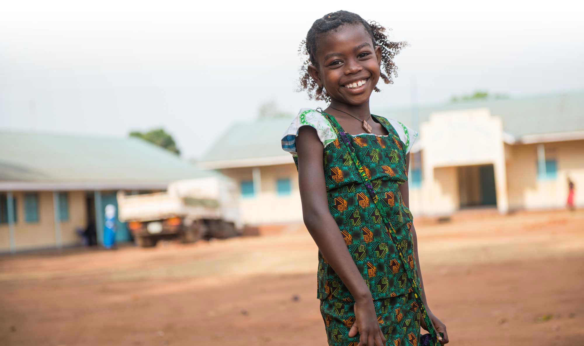 Girl standing in her village