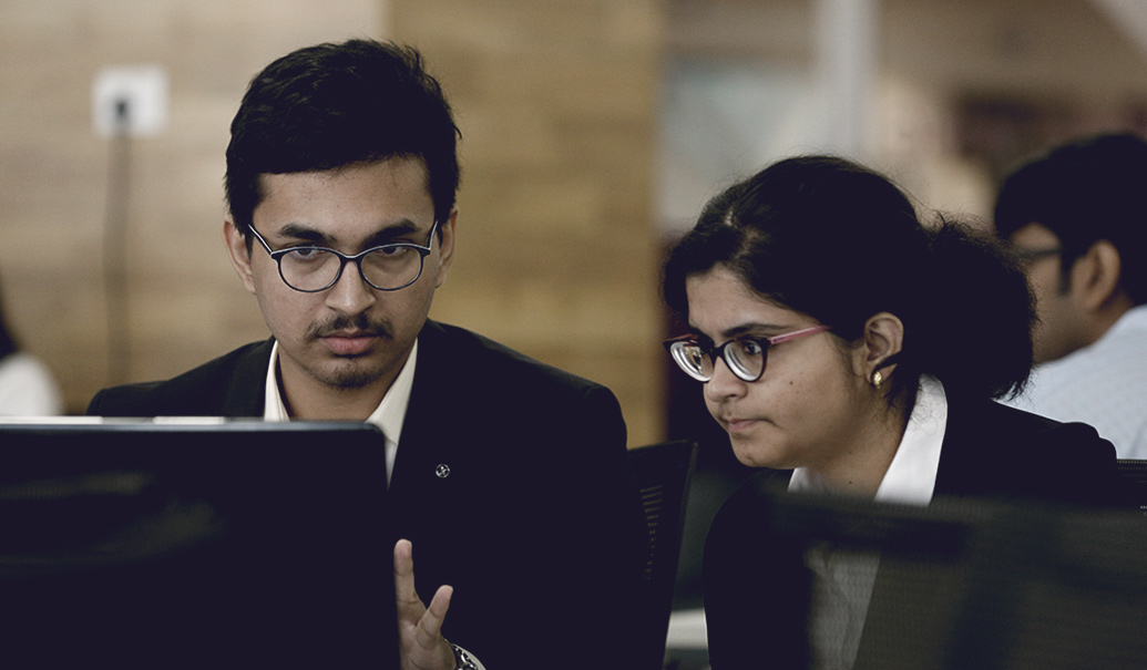 Man and woman looking at computer screen