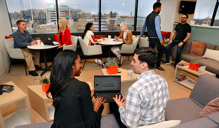 Team working late on laptop in the office