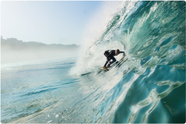 surfer catching a wave