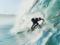 surfer catching a wave