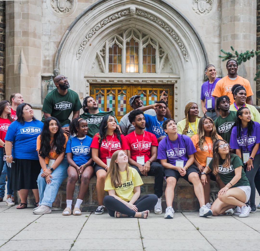 Students standing in front of a doorway