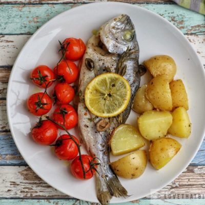 dorado, sea bream, baked, potatoes, tomatoes, cherry, lemon, sliced, classic, baked, recipe, easy, fresh, fish, herbs, rosemary, olives, black, thyme tasty, delicious