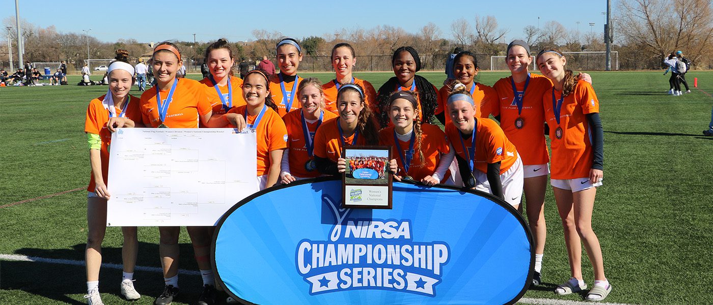 flag football champion team with medals and banner