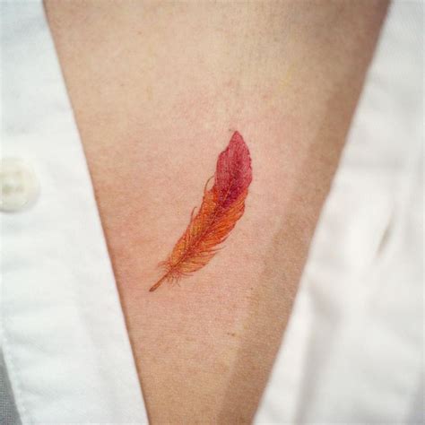 Red feather tattoo | Feather tattoo design, Feather tattoo, Tattoos