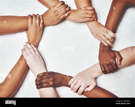 We all need a hand to hold on to. a group of hands holding on to each other against a white ...