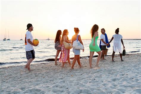 "Friends Walking On A Beach At Sunset" by Stocksy Contributor "Ivan Gener" - Stocksy