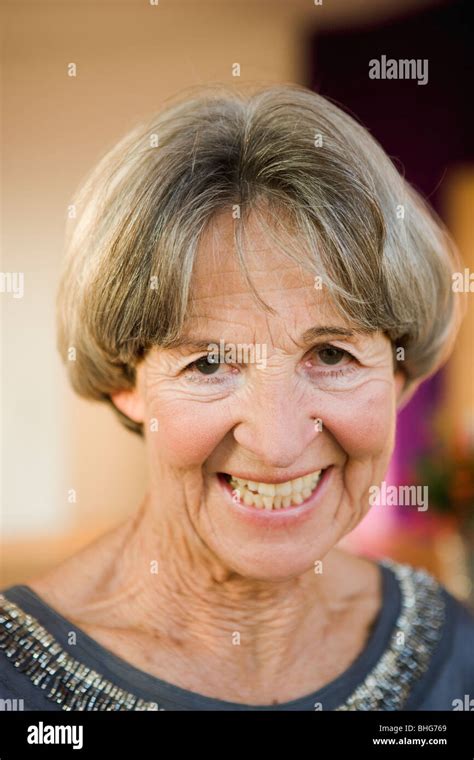 old woman smiling at viewer Stock Photo - Alamy