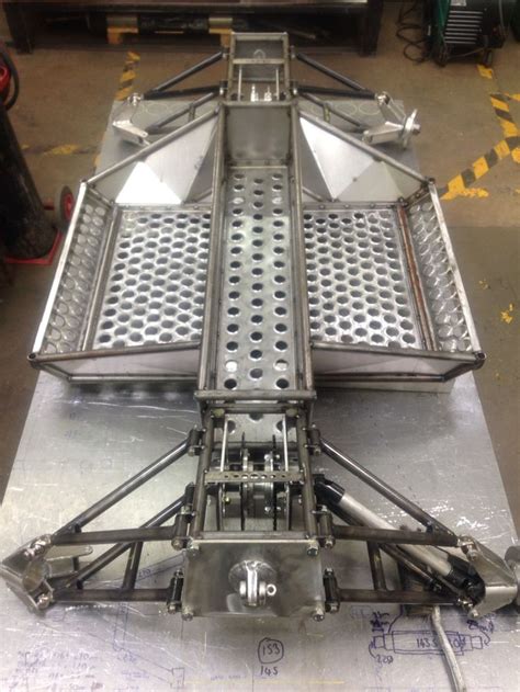 The chassis subframe as it stands now. Both front and rear drive sprockets are mounted in. Just ...