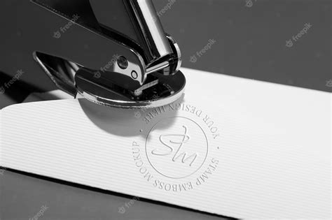 Premium PSD | Metallic stamp with embossed logo effect on paper