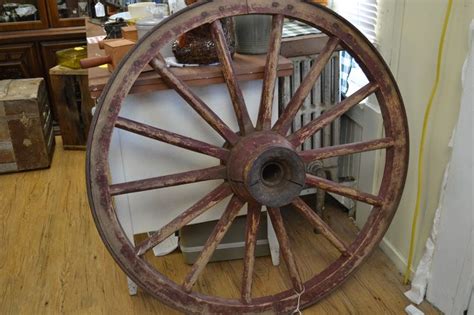 LATE 1800'S WOODEN WAGON WHEEL. THIS WHEEL WAS ONE OF THE LAST WHEELS MADE IN THE HUNTINGBURG ...