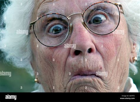 Elderly woman making funny face Stock Photo - Alamy