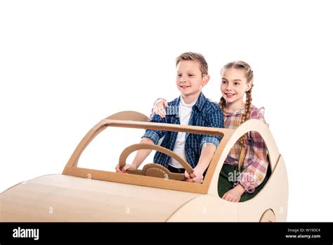 happy kids sitting and playing with cardboard car Isolated On White with copy space Stock Photo ...