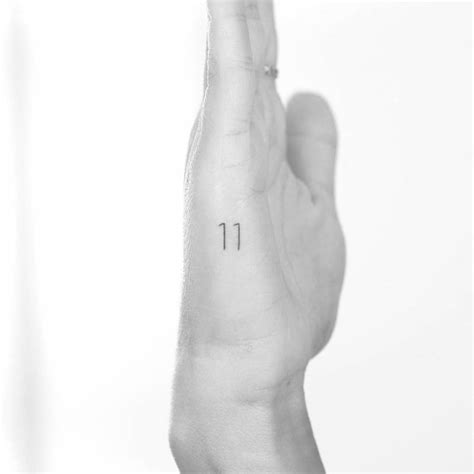 Number "11" tattoo on the hand