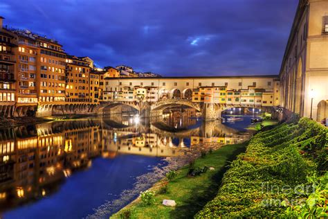 Ponte Vecchio Bridge In Florence, Italy. Arno River At Night Photograph by Michal Bednarek