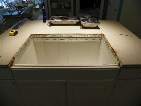 The Solid Surface Countertop Repair Blog: Corian Countertop Alteration. New Cooktop