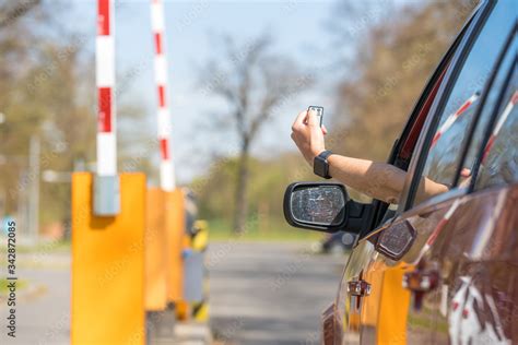 lifting barrier at the entrance to the parking lot by remote control Stock Photo | Adobe Stock