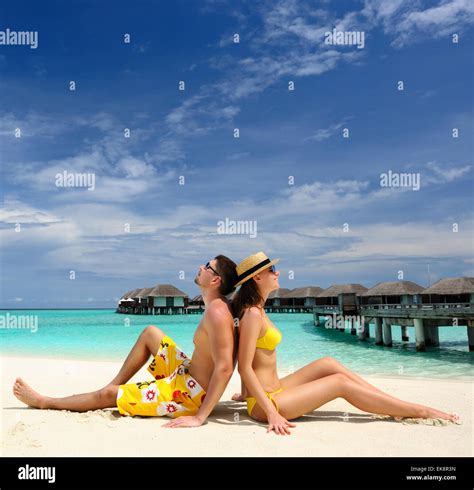 Couple on a beach at Maldives Stock Photo - Alamy