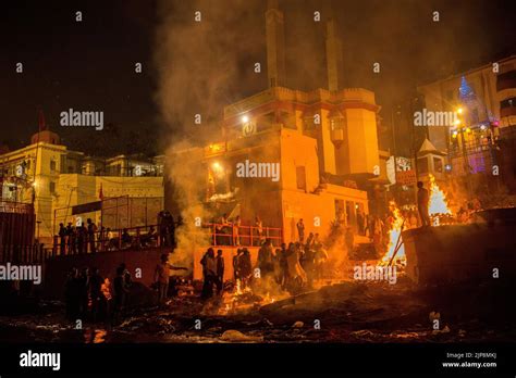 Cremation ritual burning funeral pyres at Harishchandra Ghat, Varanasi, Banaras, Benaras, Kashi ...