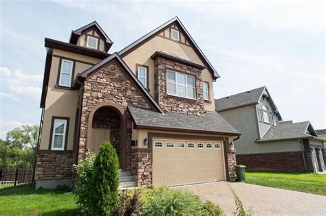 Upgrade Your Curb Appeal: Transform Your Home with a Brown Brick House and Black Shutters