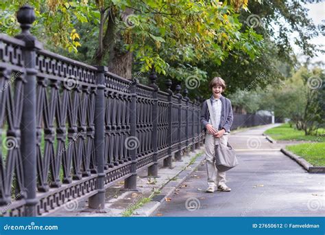 School Boy Walking Home on a Rainy Autumn Day Stock Photo - Image of happiness, positive: 27650612