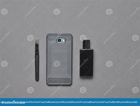 Men S Business Accessories Layout on a Gray Surface. Top View. Pen, Smartphone, Perfume Bottle ...