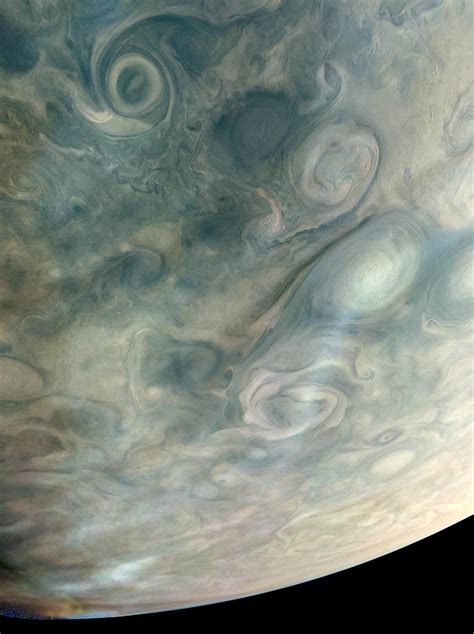 A stunning image of Jupiter's atmosphere taken by NASA's Juno spacecraft reveals haze at high ...