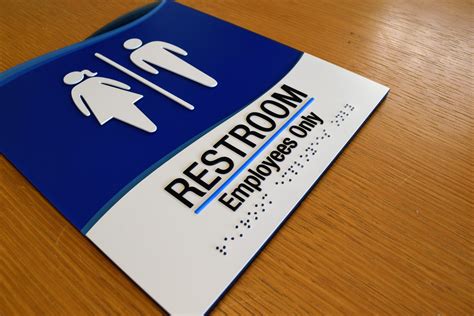 ADA compliant staff restroom sign. Raster braille with raised letters. Engineered & fabricated ...